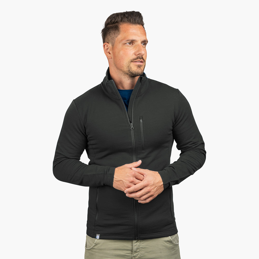 m² aus Merinowolle, Viskose und Spandex, getragen von männlichem Model, mit Reißverschlusstasche; ideal für Outdoor-Aktivitäten.