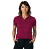 Donna indossa Merino Poloshirt Damen, design sportivo-elegante in lana merino traspirante, ideale per attività all'aperto.