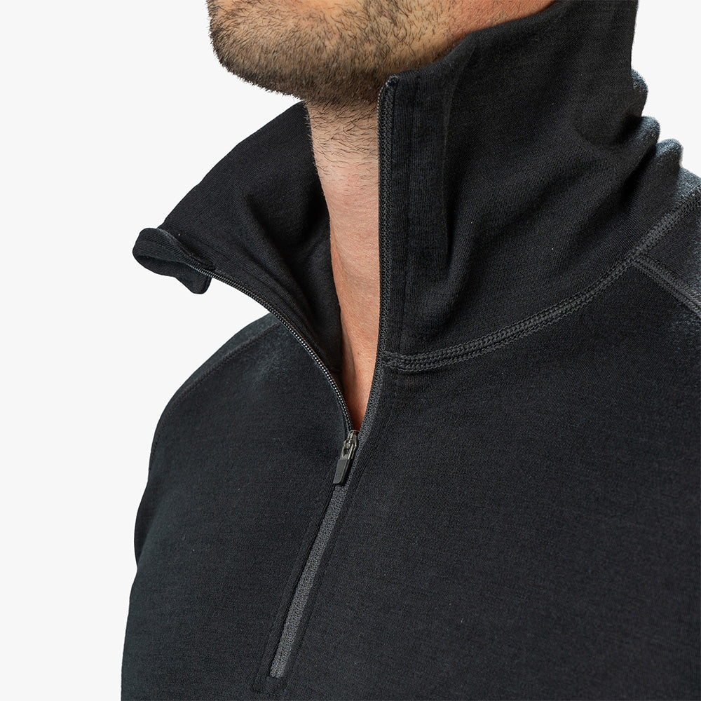 m², aus 100% Merinowolle, mit ¼-Zip für Belüftung, ideal für Outdoor-Aktivitäten und mehrtägige Touren.