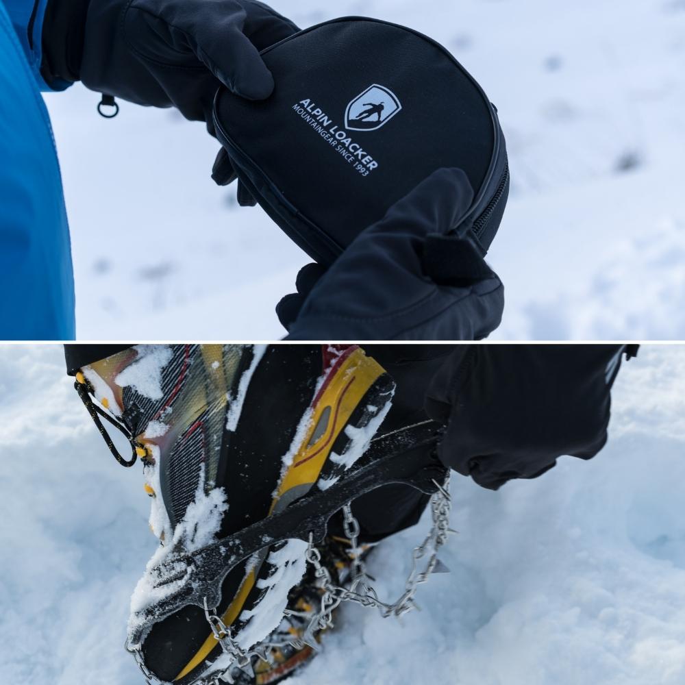 Person hält eine schwarze Tasche mit Alpin Loacker Chain Pro 18 Grödeln, ideal für sicheren Halt auf Schnee und Eis dank 18 Edelstahlspikes. Perfekt für Winteraktivitäten.